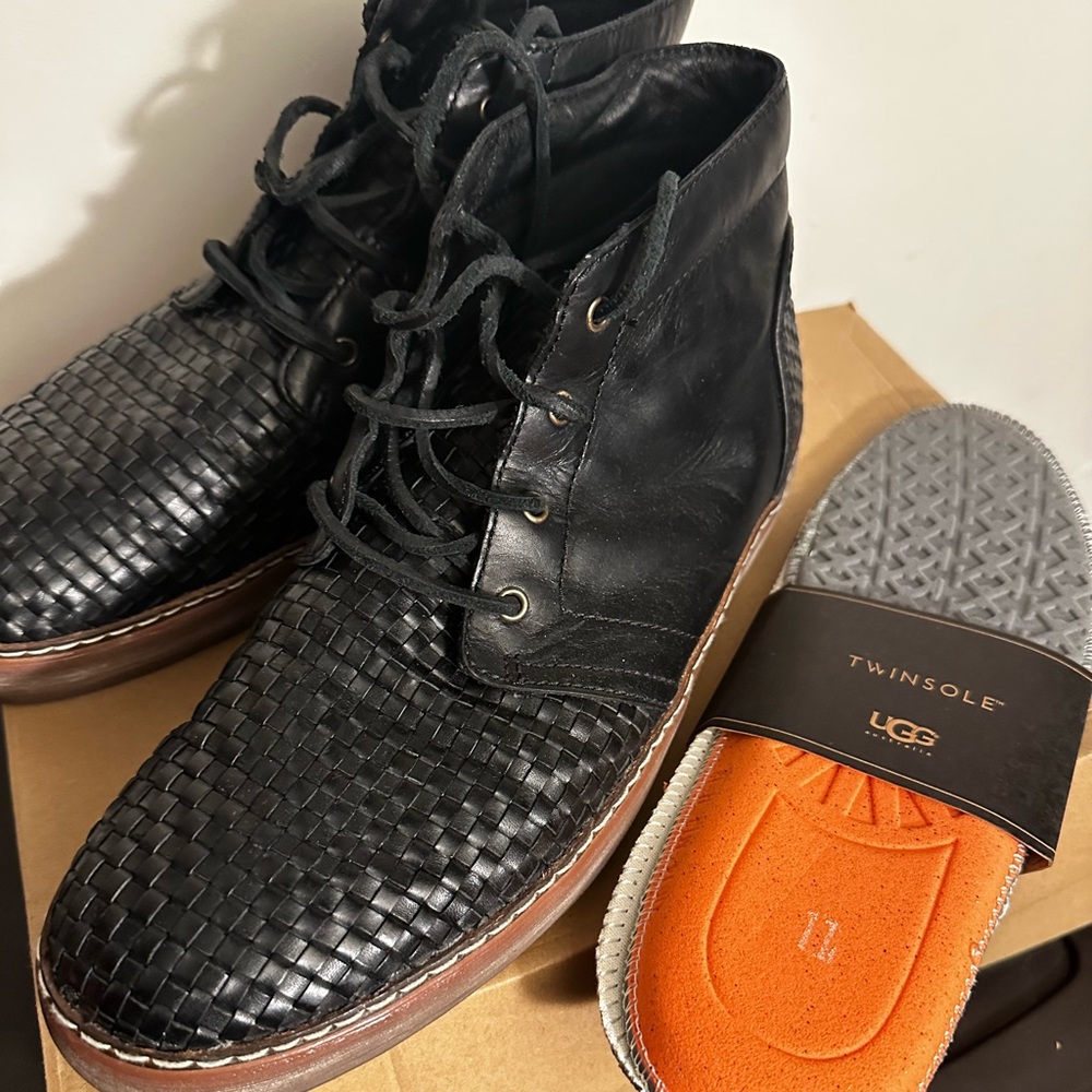 Men’s black leather UGG boots.